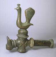 This large bronze faucet features a peacock spigot and a lion-headed spout.