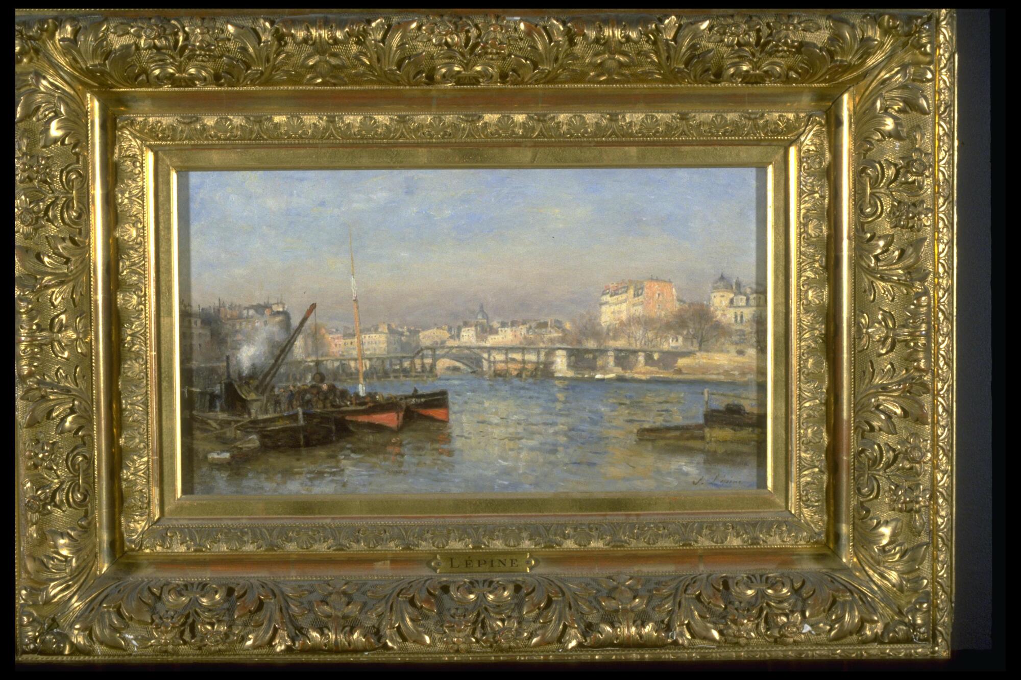 This painting shows a view of the Seine river in Paris, including the wooden bridge, the Pont de l'Estacade.  The foreground is filled is small boats and a dock winch, while the in the distance the bridge and buildings of Paris glow in late afternoon light.