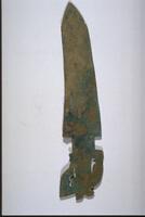 ceremonial bronze ge dagger-axe, with pointed blade on one end and zoomorphic tang of stylized bird motif on the other.