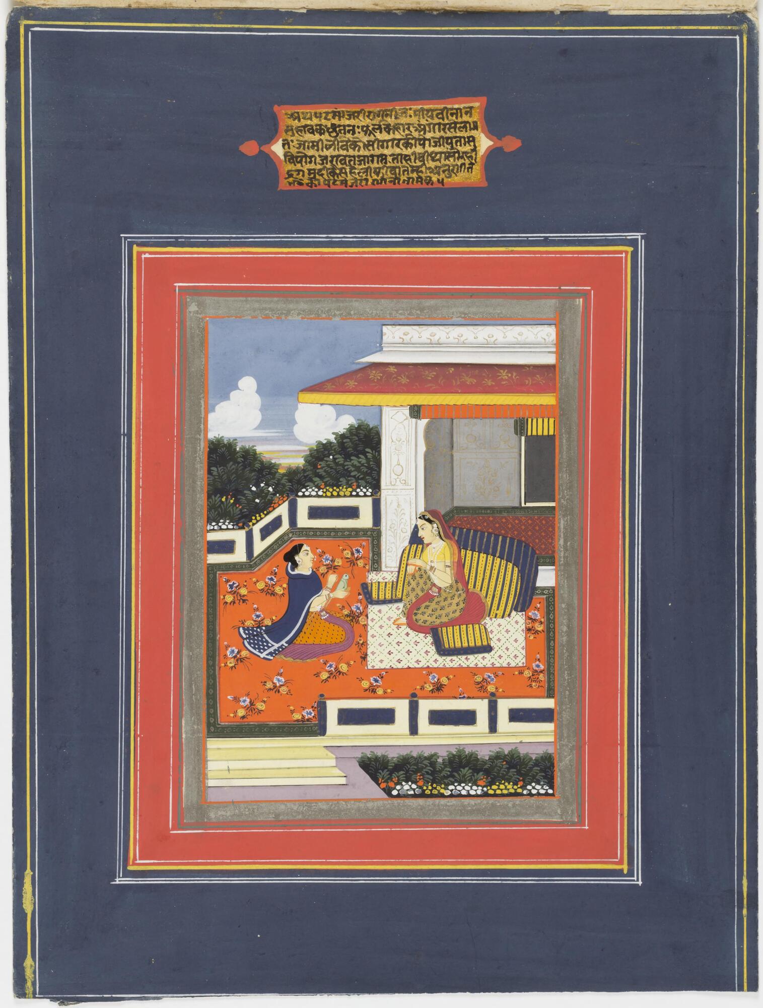 A lady sits on a low-rise bed, facing her attendant. The attendant is holding a parrot, and the lady's gaze is directed towards the bird. It is daytime and an open pavilion is situated behind them. A short verse is painted above the depicted scene.