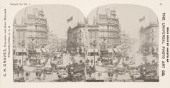This black and white stereoscopic image features two images showing the busy intersection of Piccadilly Circus in London. There are many horse-drawn carriages and wagons and pedestrians on the streets and walkways.  It is surrounded by the text: Sample Set No. 1; C. H. Graves, Publisher and Gen’l Manager; 7505 Piccadilly Circus, London<br />