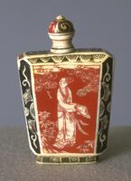 A ivory snuff bottle with a painted red and white image of a Chinese beauty with flowers and clouds surrounding her. Bordering the painting, on the edges of the snuff bottle, and on the footing are black and white paintings of abstract designs. On the top of the snuff bottle is a mouthpiece with a stopper painted with back and red swirls.
