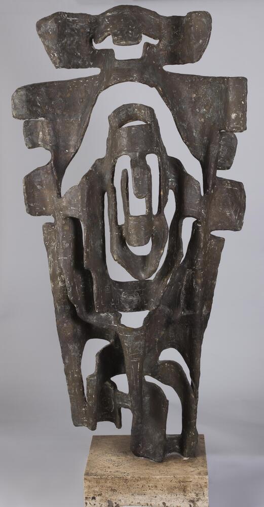 This abstract bronze sculpture on a stone base has a series of undulating flat surfaces with cut outs. With a clear frontality, the back of the sculpture has a more rustic patina.&nbsp;