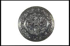 bronze mirror with highly polished surface, back side deocrated with lions and grape motif and an animal shaped knob in the center.