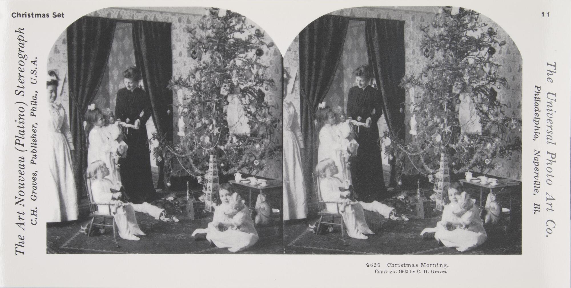 This black and white stereoscopic image features two images of four children and two women around a Christmas tree, a doorway with curtains, and toys under the tree.  It is surrounded by the text: Christmas Set; The Art Nouveau (Platino) Stereograph; The Universal Photo Art Co., 4624 Christmas Morning, Copyright 1902 by C.H. Graves.<br />