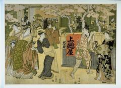 A color print depicting groups of women in kimono and men gathered under blossoming trees. The woman to the far right wears a dark kimono with an undistiguishable pattern. The next woman to her left wears a dark kimono with white dots. To her left is a woman wearing a kimono of multiple layers and single colors. She is surrounded by two girls with matching kimono. The final woman to the far left wears similarly colored material, though not as many layers. The man is wearing an outfit of geometric squares.<br />A group of one woman and two men is depicted in the back to the left while another group is entering the scene behind them. In gront of the large group are two men talking. Two men appear to be looking outside the screens of the building, and to the right of them is a group of three women and one man talking.