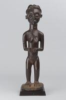 Standing female figure with her hands on her stomach.&nbsp;