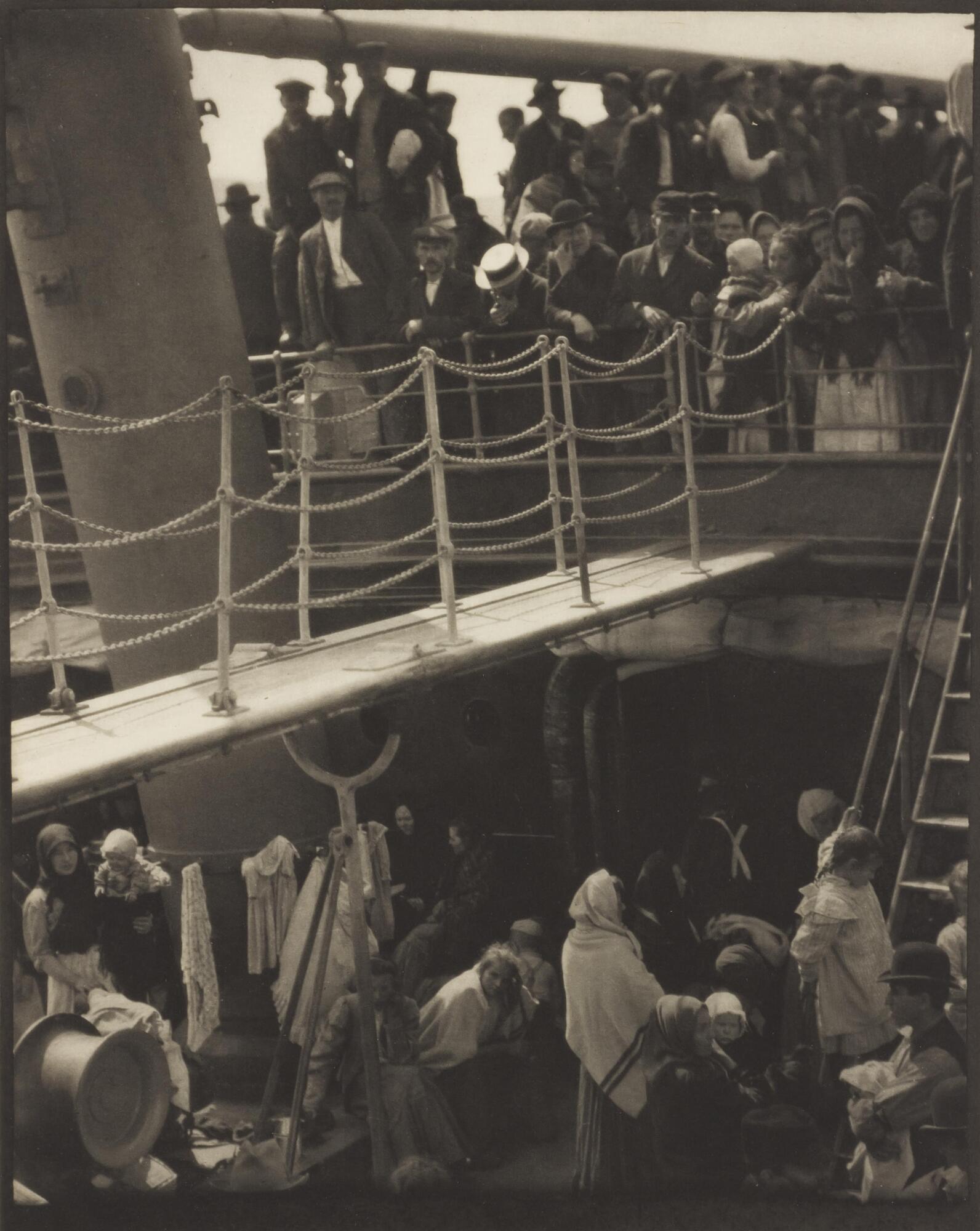 A view of steerage passengers gathered on two decks of a steamship.&nbsp;
