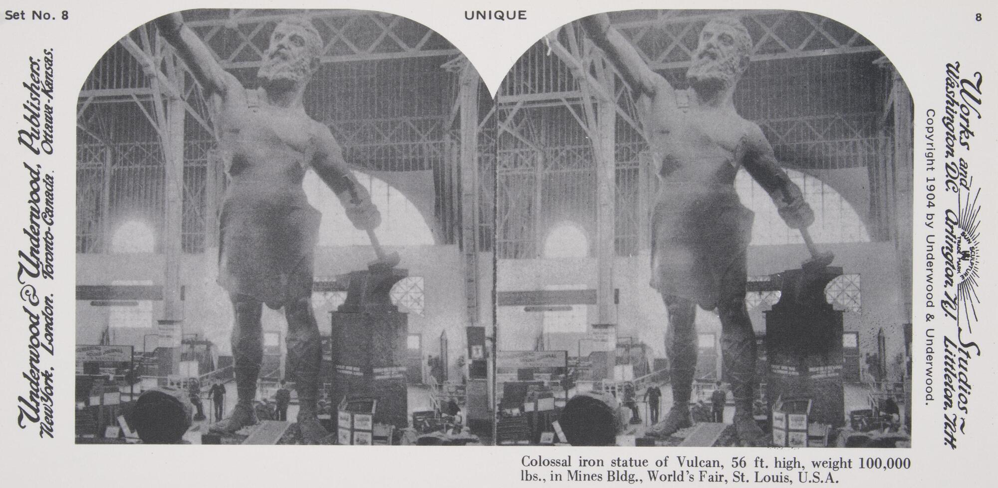 This black and white stereoscopic image features two images of an enormous statue of Vulcan with an outstretched arm in an iron building with small men standing at his feet.  It is surrounded by the text: Set No. 8; Underwood &amp; Underwood, Publishers, Unique; Colossal iron statue of Vulcan, 56 ft. high, weight 100,000 lbs., in Mines Bldg., World’s Fair, St. Louis, U.S.A.<br />