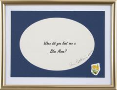 The phrase "<em>When did you last see a blue moon?</em>" is digitally printed on paper and signed by artist then placed in a mass produced frame with a flower sticker in the lower right corner. 