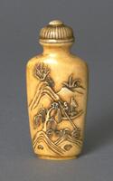 A rectangular (edges are smooth) ivory snuff bottle. Carved on the surface of the snuff bottle is a landscape scene with mountains, plants, and a man standing in a boat on the river while holding a long pole to row himself forward. On the top of the snuff bottle is a mouthpiece and stopper that is dome shaped with black stripes.