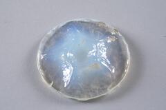<br />
This is a clouded glass half-orb with blue as the predominent color, tinged by iridescence.