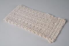 All lace black shawl, rectangular in shape, small starburst pattern all-over.