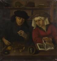 A husband and wife, looking at books and coins on a wood table. She has a red dress and a white head covering, he is wearing all dark colors and a dark hat.