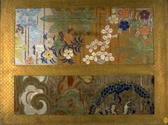 This brocade makes use of gold thread, creating a composite that shimmers. the warm, muted tones of the gold are matched in color selections of light blue, dark blue, yellow, mauve, silvery white, and muted green threads. Two textile fragments have been sewn into a gold background. On the left is a rectangular segment of a blue and green dragon among clouds. The right segment is a floral decoration of a variety of plants and colors, interspersed with horizontal lines.