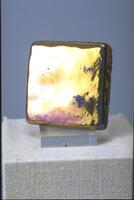 Square ceramic tile with iridescent metallic glaze