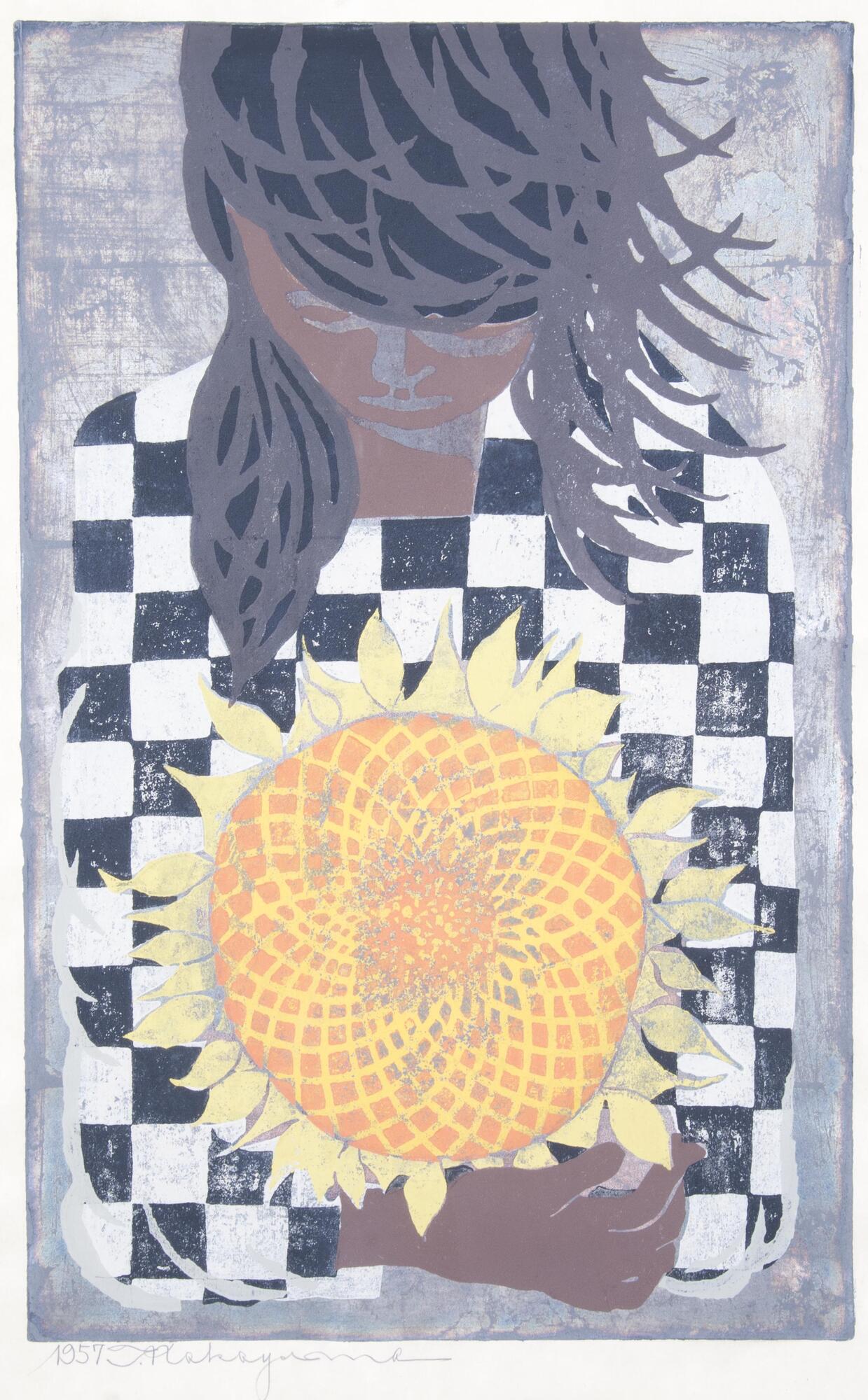 A portrait of a girl wearing a black and white checkered shirt, looking down at the sunflower she is holding in her crossed arms.