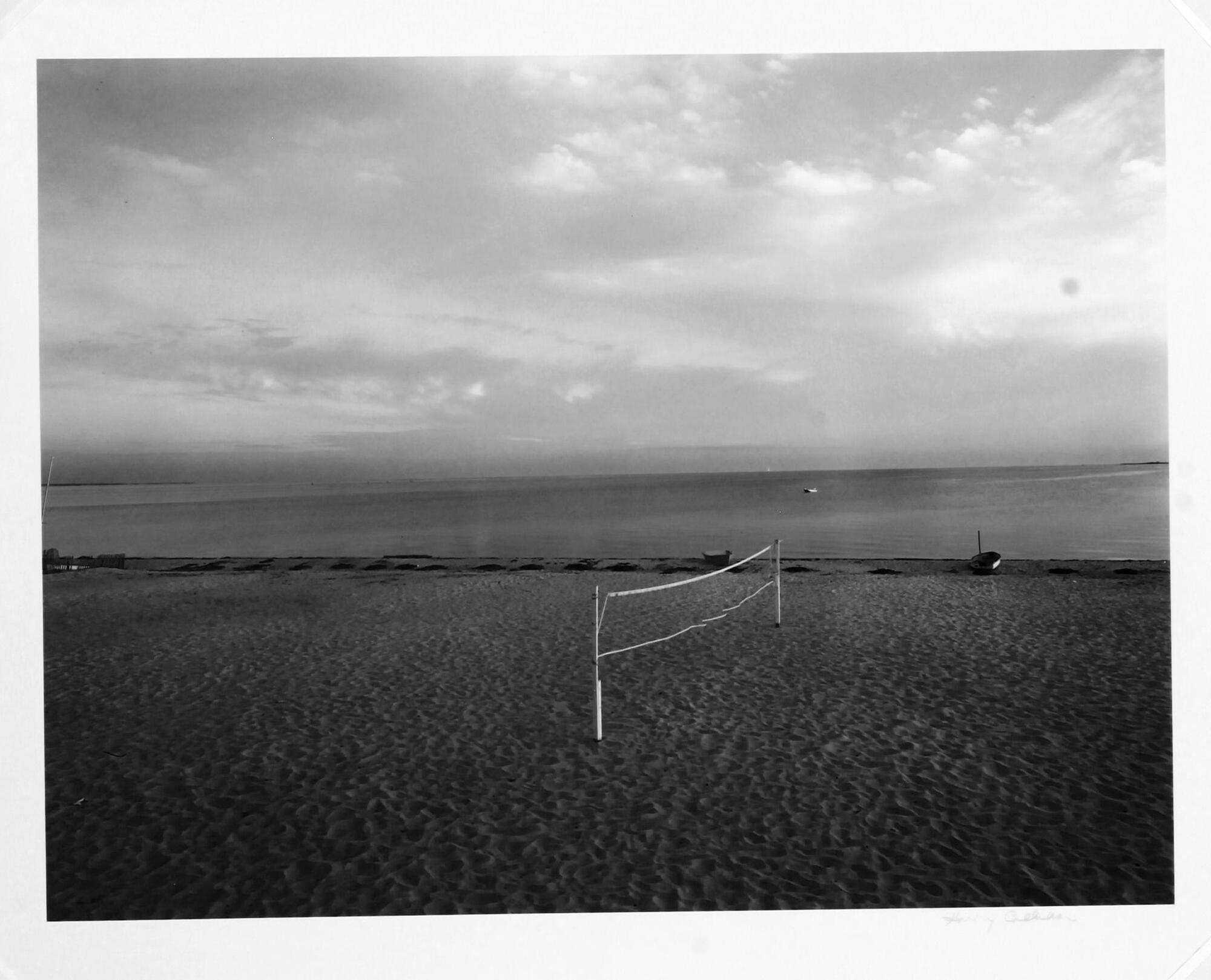 Empty beach with a volleyball net set up.