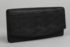 Black rectangular textured clutch with a curved opening, black interior with black silk lining.