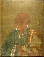 The hanging scroll fragment depicts a portrait of a Buddhist monk. The man is bald, wearing heavy robes of orange and blue. The man looks off to the left of the painting with his body oriented in that direction as well. His hands are folded in front of him and are hidden in his robes. He sits in a background of a brown-yellow color.&nbsp;