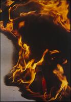 Image mostly darker flames with gray background.