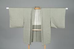 Light green chirimen silk Haori with interwoven floral pattern, off-white silk with floral pattern lining.