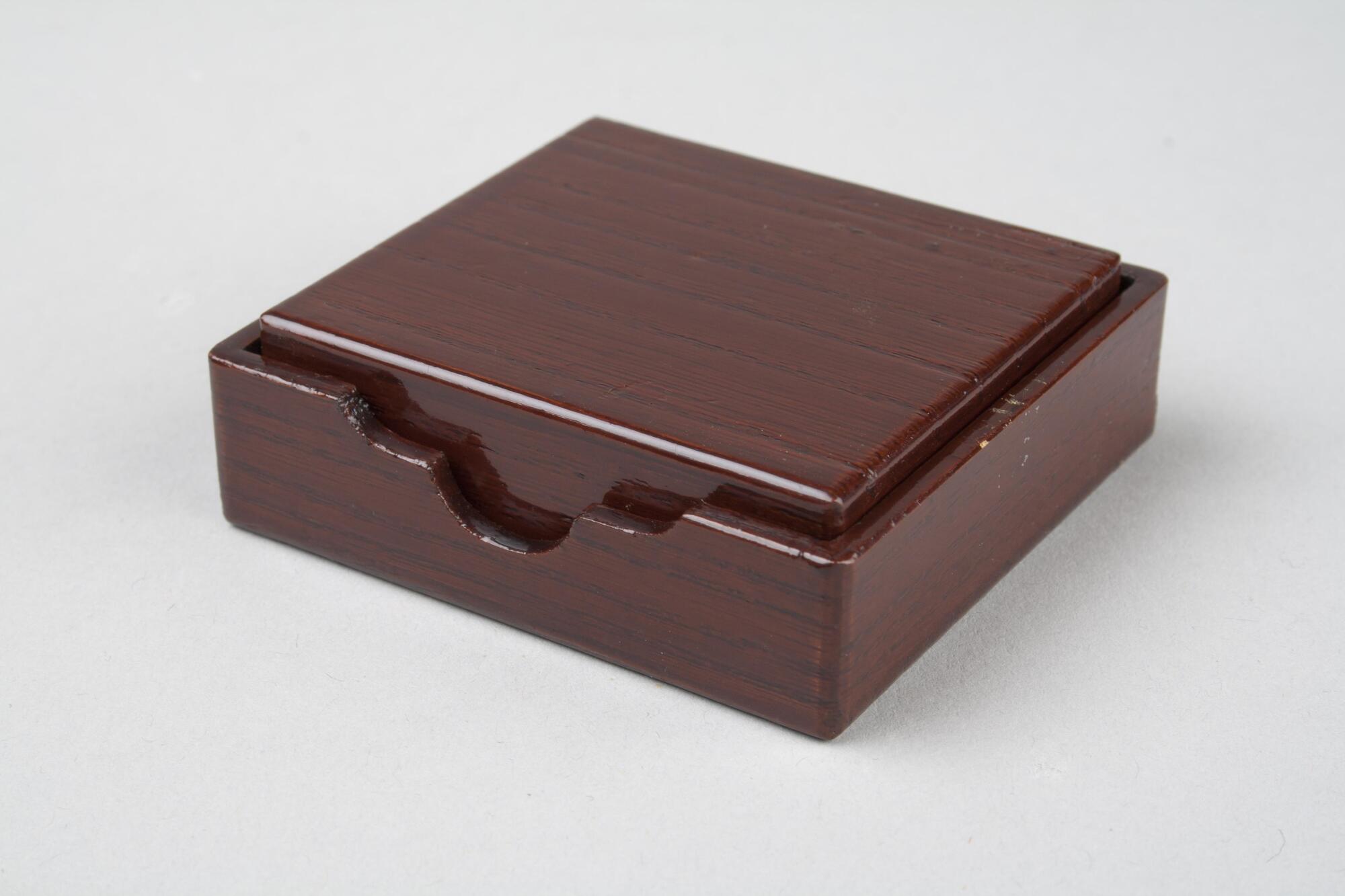 Wooden rectangular box with a lacquered finish, light wood. This is a part of a portable tea set.