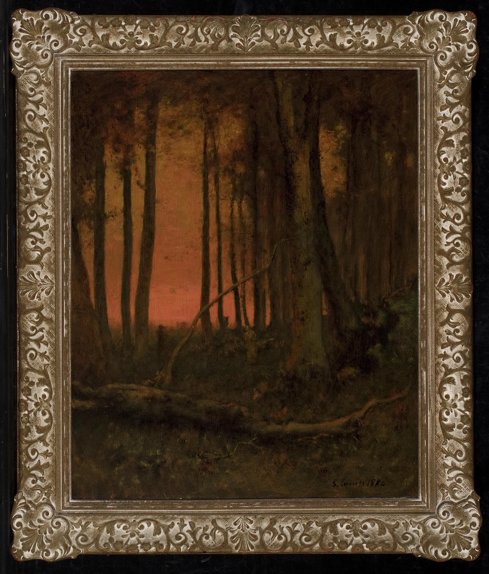 Landscape scene depicting trees silhouetted against a reddening sky with a dead fallen tree trunk lying diagonally across the foreground.