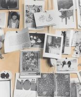One of four images taken of a bulletin board covered in cards, notes, drawings, and photographs. This image features photos and cards as well as an electrical cord running through the center with the switch in the middle of the image.  