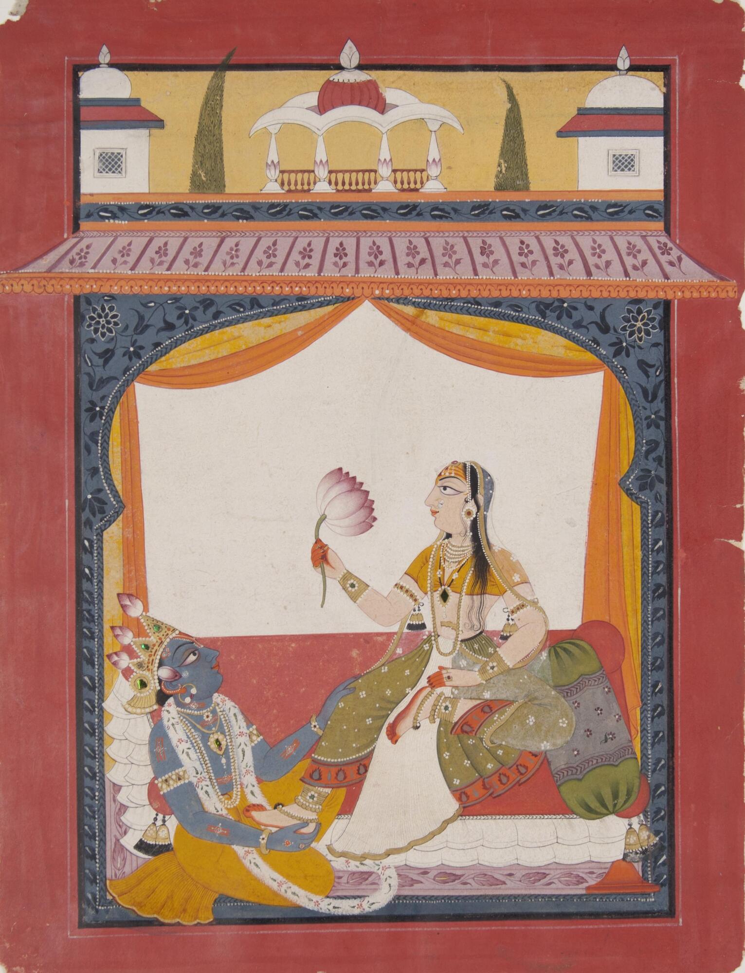 Bold colors depict Krishna, one of human manifestations of the Hindu god Vishnu, is seated with a woman, Radha, above him. He touches her leg, and the tips of her hands and feet glow red. She sits erect and holds a large flower, looking straight off the left edge of the picture. The two are framed in an architectural structure.