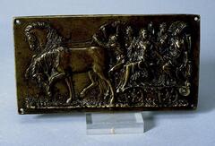 Two horses pull a wagon carrying four female passengers in this small bronze plaque. The driver, a seated nude male with a cap takes the reins in his left hand and raises a whip in his right. Behind him sit two pairs of taller female figures, each wearing a long flowing mantle.