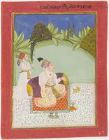 The central figure in the foreground is seated outdoors on an orange carpet with a green border, which is itself on a white carpet decorated in a floral pattern.  He reclines against a pillow. He is dressed in a sheer white shirt and yellow dhoti with a headdress. He is wearing a pearl necklace and has pearls in his headdress. His right hand rests on a foot while the other hand is extended outward. Behind him to the left is an attendant who is holding a fan over the central figure's head. The attendant is dressed more simply in white with a red headdress. A large hill looms in the background against a dark blue sky. An inscription is placed in the red border of the painting.