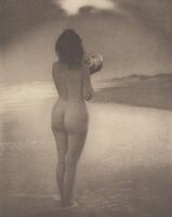 Nude woman turned away from the viewer. She is holding a glass sphere at the height of her shoulder, standing in shallow water.