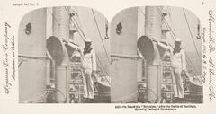 This black and white stereoscopic image features two images of a man in a white sailor uniform pointing to a hole in a smokestack.
