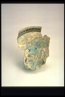 This Mina'i ware bowl profile fragment features painting in blue, black, white, green, and red over turquoise glaze. Two confronted horesman and conventionalized inscriptions near the rim are the main decorative features.<br /><br />
 
