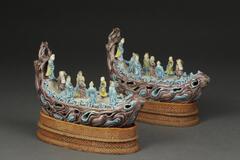 Eight immortals riding boat through gates of heaven with aubergine, blue and yellow glaze and custom cloth stand.