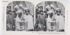 This black and white stereoscopic image features two images of Santa entering a room with a Christmas tree through a curtained window.  It is surrounded by the text: Christmas Set; James M. Davis; Copyright 1897 by R.W. Kilburn; 11616. “’Twas the night before Christmas when all through the house, not a creature was stirring not even a mouse.”