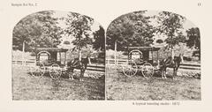 This black and white stereoscopic image features two images of a single horse drawn carriage next to a fence. The carriage has text on the side of it and the word 'views' is the most visible.<br />