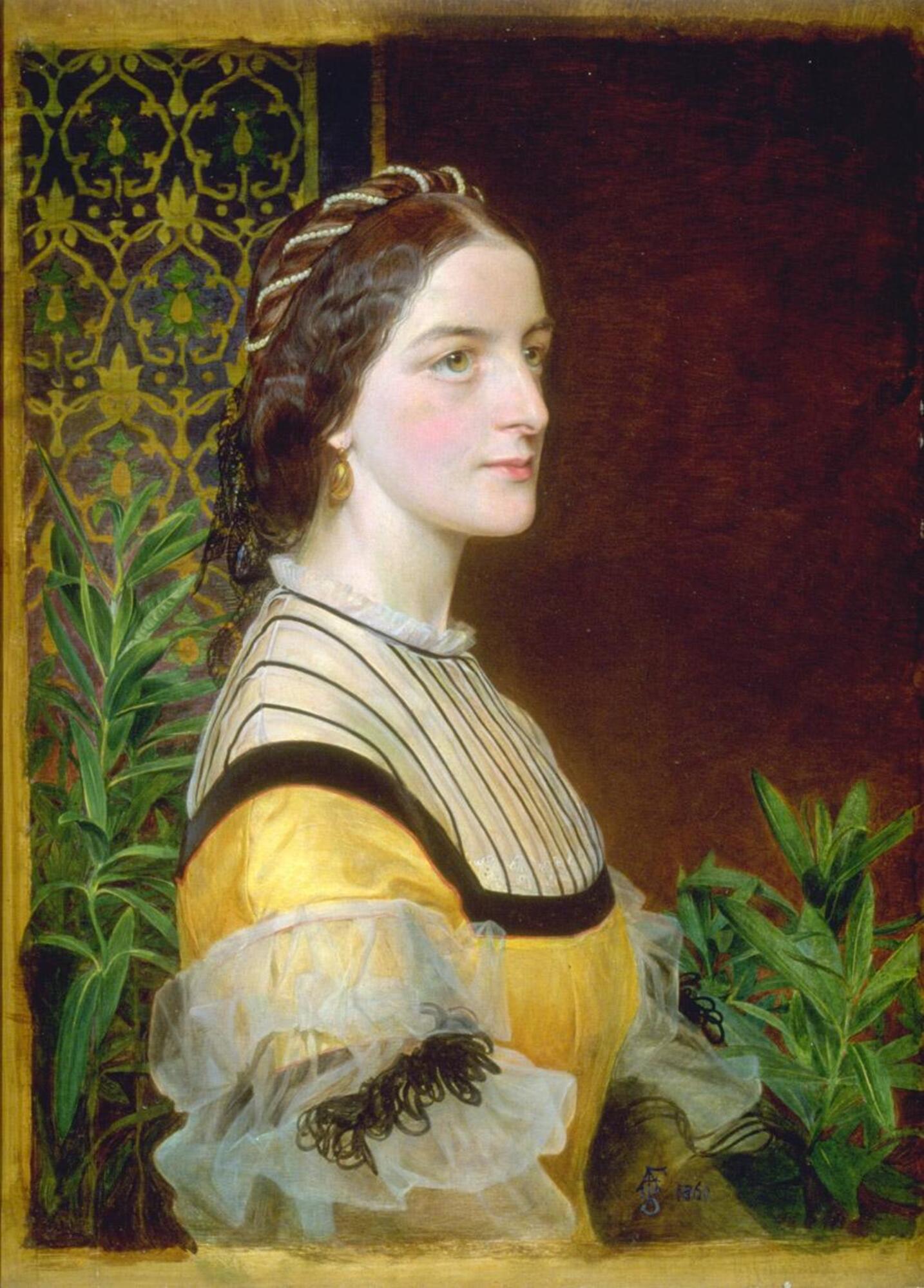 Half-length portrait of a young woman facing right with dark brown hair wearing a yellow satin dress.  The upper part of her bodice is trimmed with black ribbons arranged in vertical stripes.  She wears gold ovoid pendant earrings, and a strand of pearls in her hair.  In the background are branches of oleander, and to the left of the sitter, is a panel of brocaded textile of late medieval design.<br />