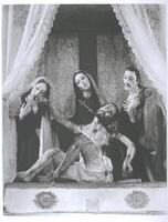 Photograph of a tableau from a Catholic church in Calvario, Patzuaro, Mexico. The scene includes a male figure at the center, with two women and one man arranged behind him.