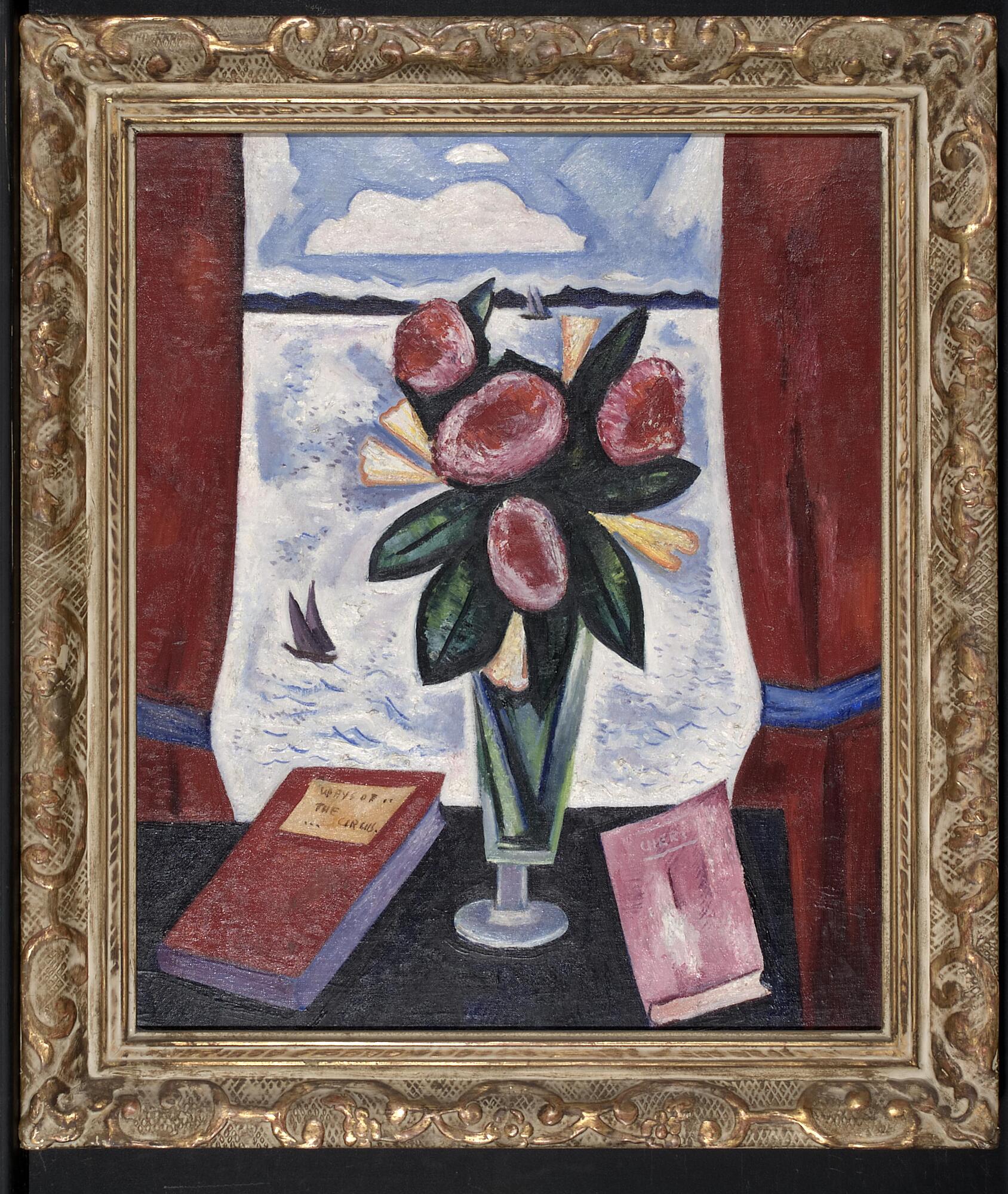 A vase with flowers sits before a window, between two books that lie on a table, and framed by open red curtains. The landscape outside the window shows a blue cloud sky above a body of water.