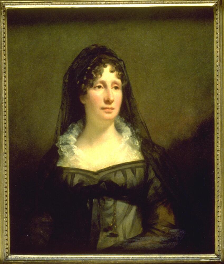 Lady Eleanor Dundas is shown half length, seated in front of a brown background.  She looks towards the light source to the right of the painting.  She is dressed in a diaphanous black dress with an Empire cut and black veil.  A sheer lace collar frames her throat.  She has heavy lidded eyes and an alert or slightly mournful expression