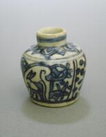 A small jar with a slightly tapered base and a shoulder that tapers to a narrow tall neck with a direct rim.  It is painted with underglaze cobalt blue with deer and floral designs, and covered in a clear glaze. 