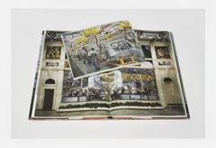Image of a book lying open to a page featuring mural depicting factory works. A newsclipping featuring a photo of contemporary factory workers lies on the book across the open page.  