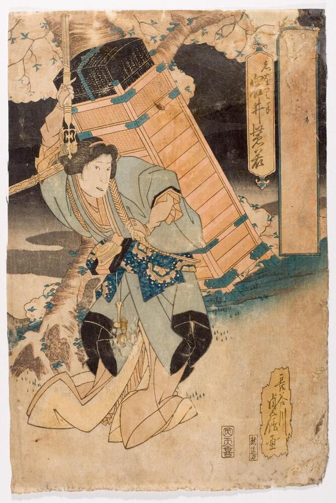 In this print, a woman carries a large box on her back.  In her right hand, she has an unsheathed sword raised above her.  Behind her is a flowering tree against a night sky.  A cartouche at the top right hase faded markings in it.<br />
 <br />
Inscriptions: Artist’s signature: Hasegawa Sadanobu ga; Publisher’s seal: Ten, tenki; Shiorite, Iwai Shijaku