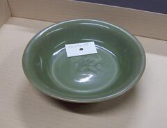 Lungquan ware shallow dish with stamp of flying horse on the bottom and celadon glaze.