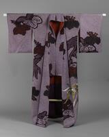 <p>lavender and white chirimen kimono with shibori dyed and interwoven violet and maroon kirimon (paulownia) with one embroidered phoenix motifs located at the bottom left and with a red and violet inner lining.</p>
