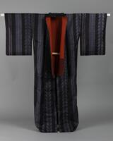<p>Ink-colored tsumugi kimono with vertical light blue, navy, and red leafy wisteria stripes with red and maroon inner lining.</p>
