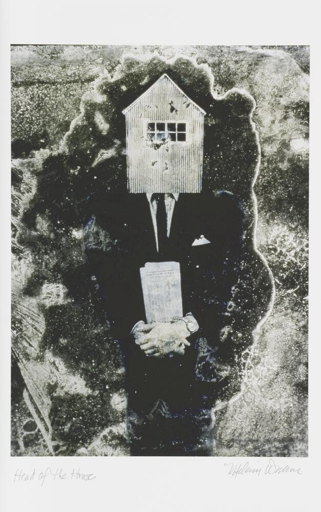 A black and white image of a male figure wearing a suit, clasping a newspaper at his waist, and with a house in place of a head. 