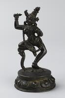 A bronze image of a dancing figure, cast in the cire perdue (lost wax) technique in one piece with its lotus-petal base.
